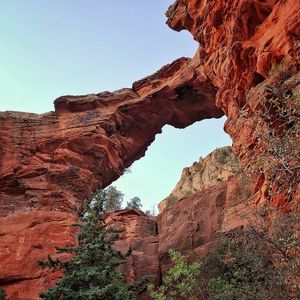 Low angle view of rock formations against sky