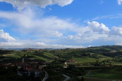 Aerial view of townscape and vineyard against sky