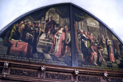 Low angle view of statues against sky