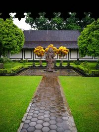 Statue in front of building