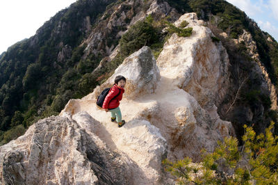 Child hiking on mountain