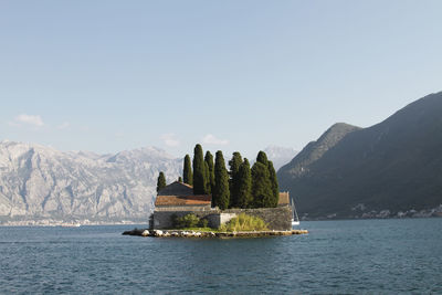 Scenic view of sea against mountain range, island