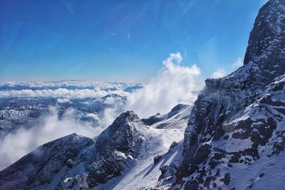 Scenic view of snowcapped mountains against sky