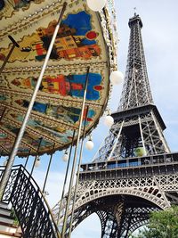 Low angle view of ferris wheel against sky