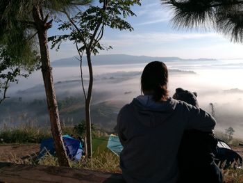 Rear view of woman looking at mountains