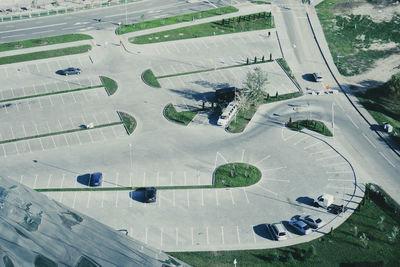 High angle view of vehicles on road amidst field