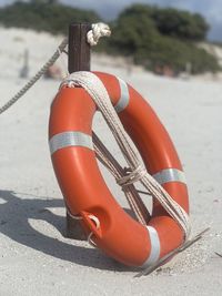 Close-up of life belt on beach