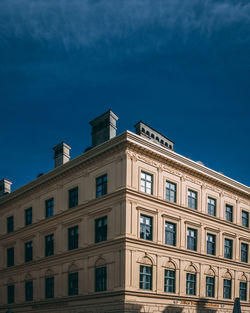 Low angle view of building against clear blue sky