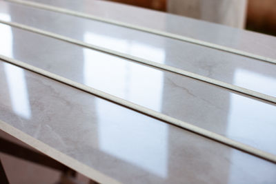 Close-up of metal grate on table