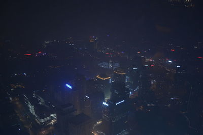 High angle view of illuminated buildings in city at night