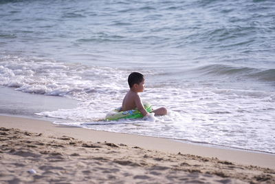 Boy playing on beach