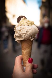 Hand holding ice cream cone