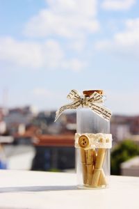 Close-up of wish bottle on retaining wall