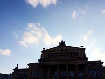 Low angle view of building against blue sky