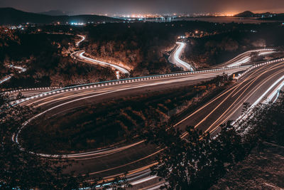 High angle view of light trails on road against sky