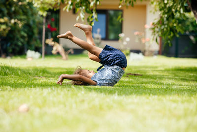 Side view of boy on field