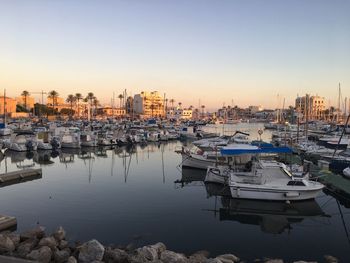 Boats moored at harbor