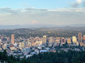 High angle view of city buildings against sky with mount hope peak view