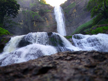 Scenic view of waterfall in forest