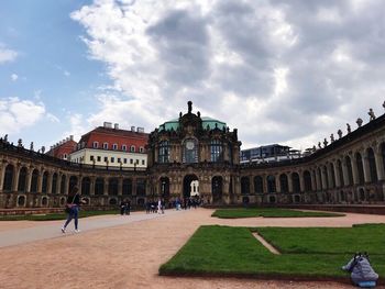 Group of people in front of historical building