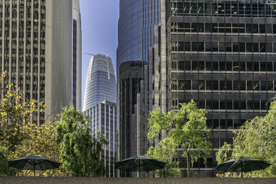 Modern buildings against sky in city