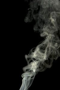 Close-up of smoke against black background