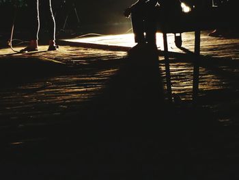 Low section of people on sea at night