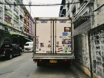 Road amidst buildings in city