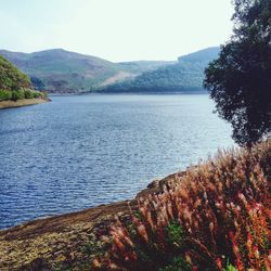 Scenic view of lake with mountains in background