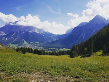 Scenic view of landscape and mountains against sky