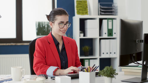 Happy woman working in office