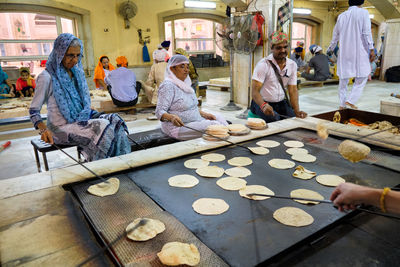 Group of people at market stall