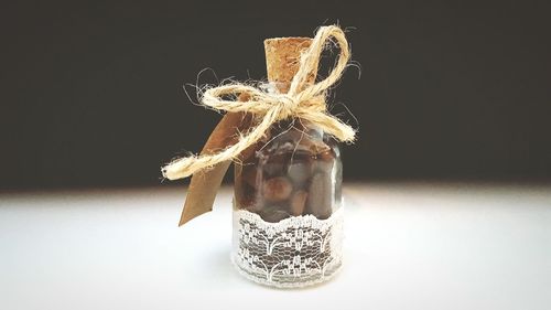 Close-up of christmas decoration hanging against black background