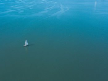 High angle view of sailboat sailing in sea