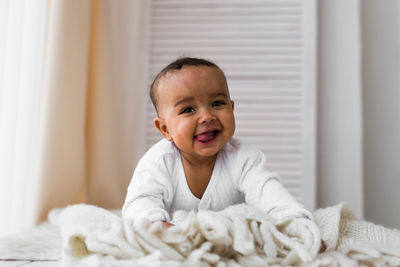 Portrait of cute baby at home