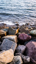 High angle view of pebbles on beach