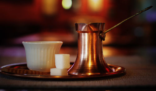 Close-up of coffee cup on table