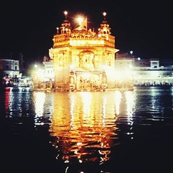 Reflection of illuminated buildings in water at night