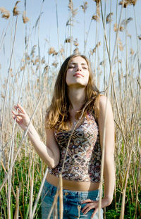 Young woman smiling on field