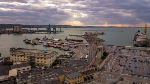 View of harbor against cloudy sky