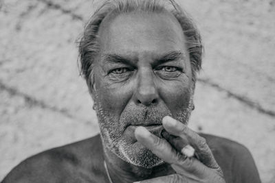 Portrait of man smoking cigar