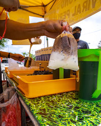  kopi gantung or iced coffee stall. local business selling local drinks.