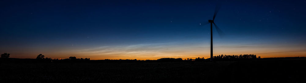 Scenic view of silhouette field against sky during sunset