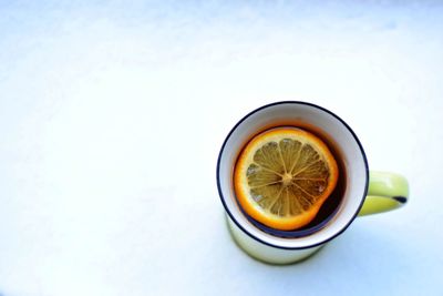 Close-up of drink in cup on snow