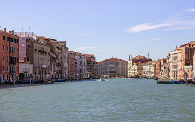 Canal passing through city buildings