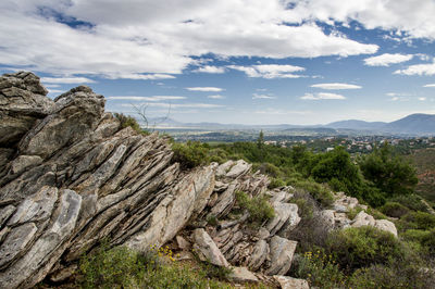 Rock formations on landscape against sky