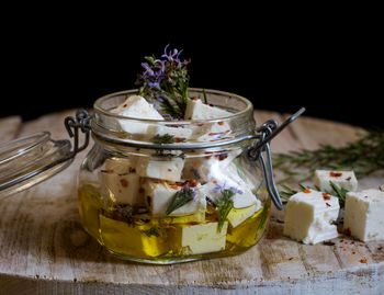 Close-up of ice cream in glass jar on table