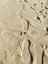 High angle view of footprints on sand