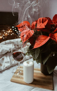Close-up of red wine in glass vase on table