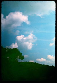 Scenic view of landscape against cloudy sky